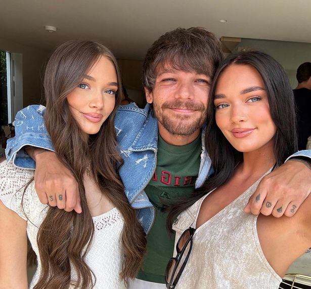 Louis Tomlinson cosies up to his sisters Phoebe, Lottie and Daisy in a rare family snap