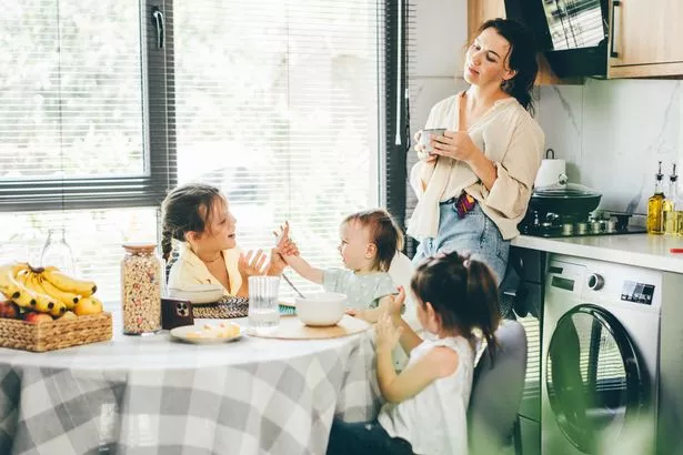 A mum watching her kids play