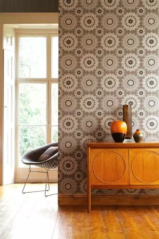 Wooden cabinet with flower vases against floral wall in modern home