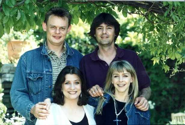 Martin Clunes, Neil Morrissey, Caroline Quentin and Leslie Ash pose outside under a tree dressed for spring