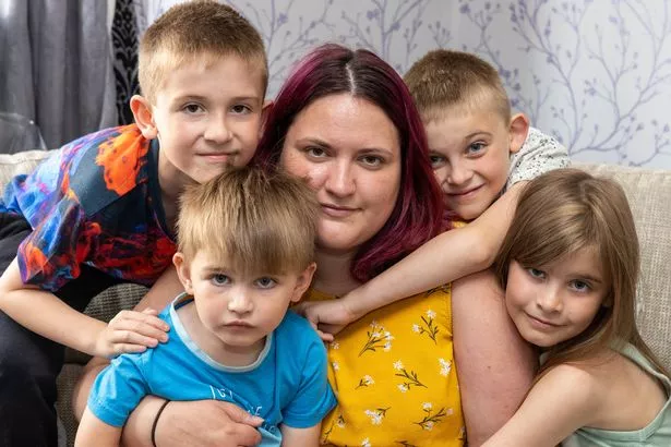 Cancer patient Ashleigh Ellerton surrounded by her four children as she talks about her terminal diagnosis