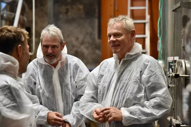 Neil Morrissey and Martin Clunes don hazmat suits to go inside a wine vat at a vineyard