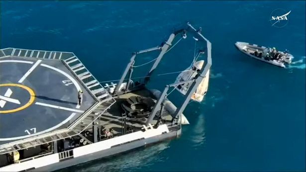 the SpaceX Crew-9 astronauts being lifted onto the recovery vessel 