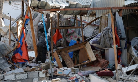 Residents inspecting the site of an Israeli strike on a house in Khan Younis.