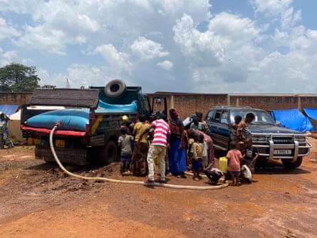 People fetching water at the displacement centre.