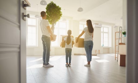 Couple with child move with boxes in a new property