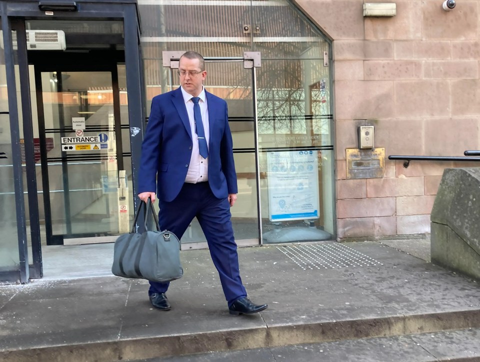 Man in suit leaving Nottingham Crown Court.