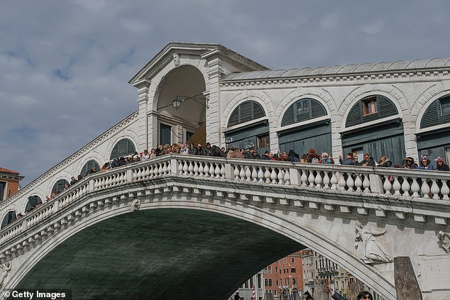 Tourists crowd the Rialto Bridge on March 01, 2025 in Venice, Italy