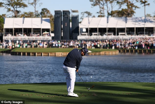 With 20mph hours swirling above the 17th hole, Spaun clubbed up to an eight-iron and sent his ball long over the green into the water