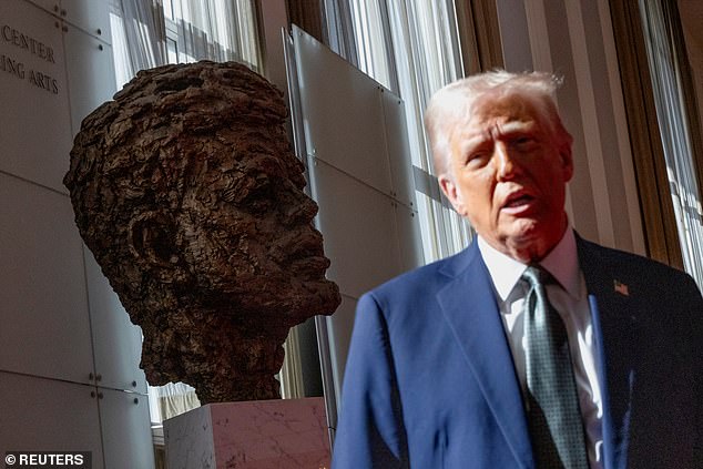 Big head: Trump speaks to the media after attending a board meeting at the Kennedy Center