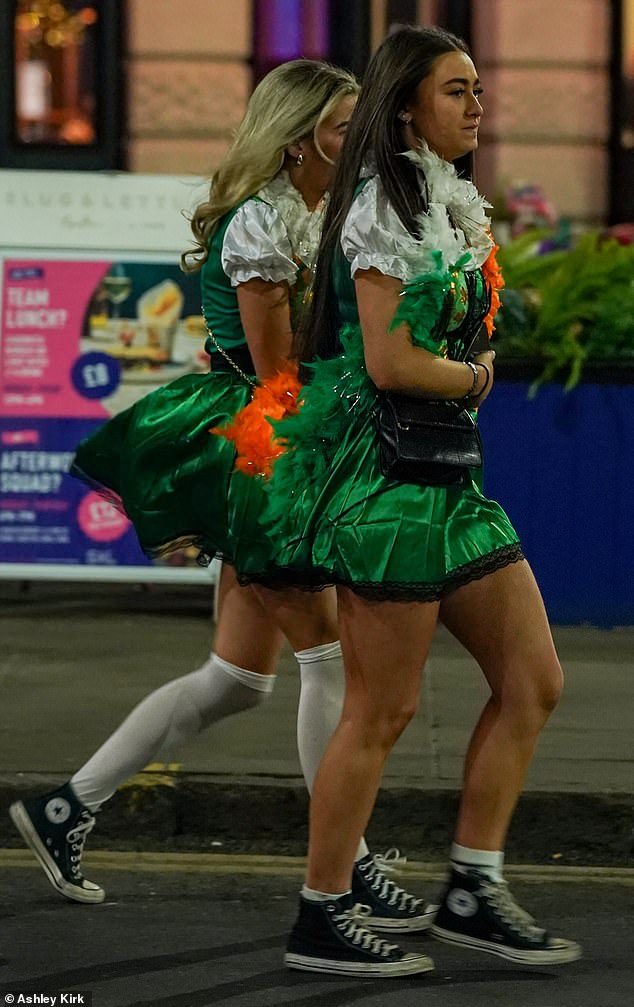 Two friends were seen in committed all green outfits as they partied in Nottingham