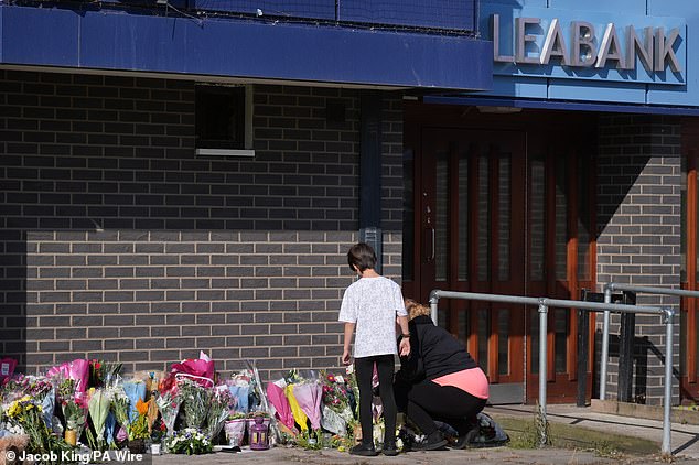 Tributes were left outside the Leabank building after the triple killing in September last year