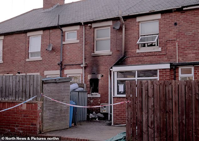 Emergency services taped off the house following the blaze in Kingsley Road, Lynemouth