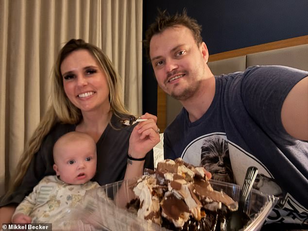 Ryan Becker is pictured in a hotel room ahead of his visit to the Mayo Clinic with his wife Mikkel and four-month-old baby Atlas