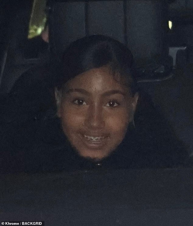 North, 11, who is embarking on an entertainment career, smiled as she sat in the vehicle