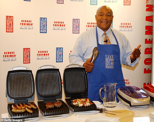 Foreman poses while launching his 'Lean, Mean Fat Reducing Grilling Machine' in 2001