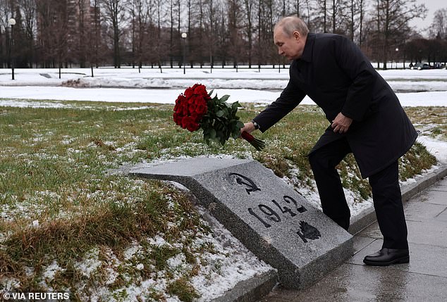 That winter of starvation ¿ still commemorated by the city and Vladimir Putin every year in huge ceremonies ¿ remains almost beyond comprehension. Pictured: Russian President Vladimir Putin lays flowers at the Piskaryovskoye Memorial Cemetery during a ceremony marking the 80th anniversary of a breakthrough in the siege of Leningrad