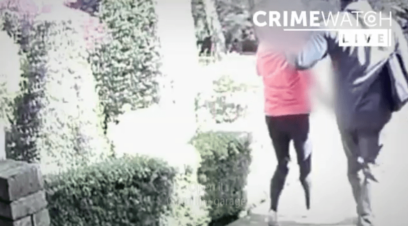 Screenshot of Crimewatch Live showing two people running.