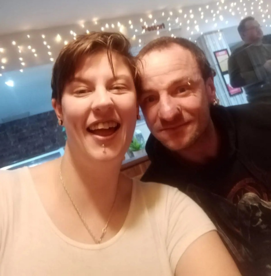 Selfie of a smiling woman and man.