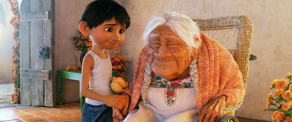 Miguel and Mama Coco from Coco.