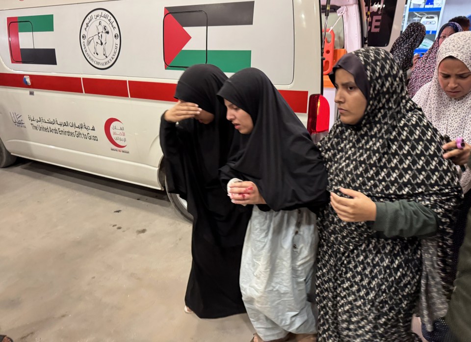 Injured Palestinian women and children being brought to a hospital.