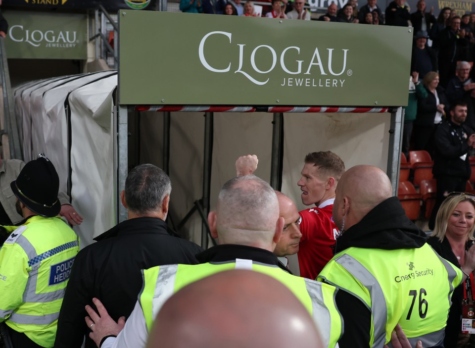 James McClean of Wrexham gestures to fans after a match.