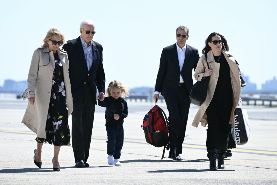 The Biden family walking at an airport.