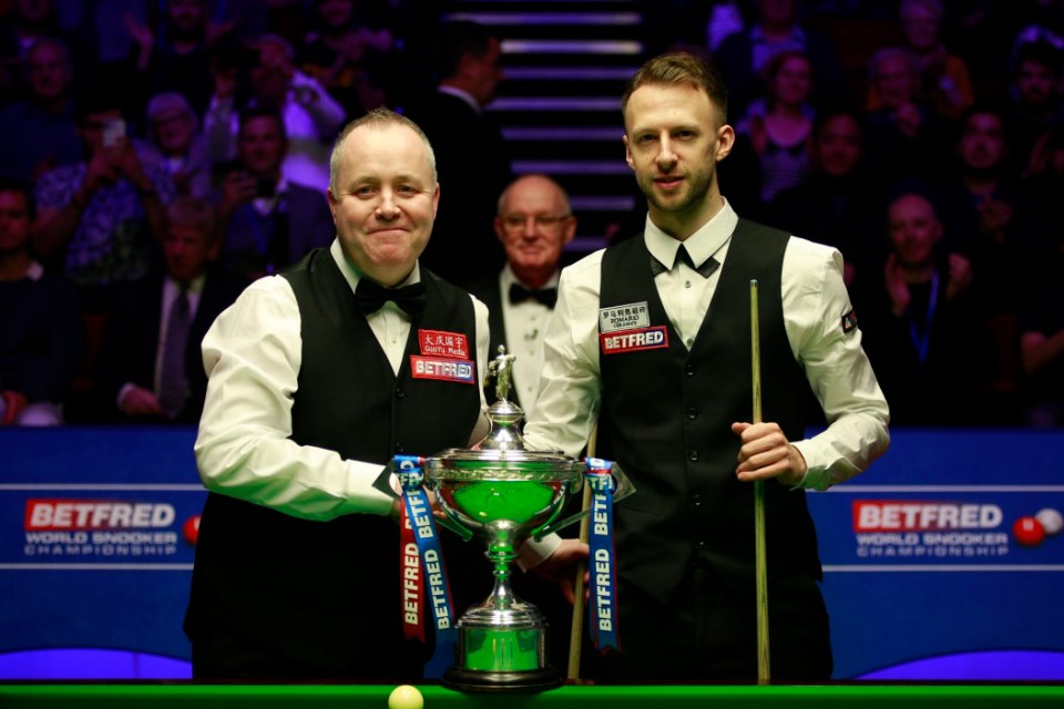 SHEFFIELD, ENGLAND - MAY 05: John Higgins (L) of Scotland shakes hands with Judd Trump of England prior to their final match on day 16 of the 2019 Betfred World Snooker Championship at Crucible Theatre on May 5, 2019 in Sheffield, England. (Photo by Tai Chengzhe/Visual China Group via Getty Images)