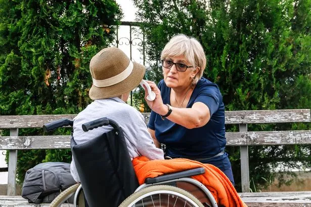 Carer looking after a disabled person
