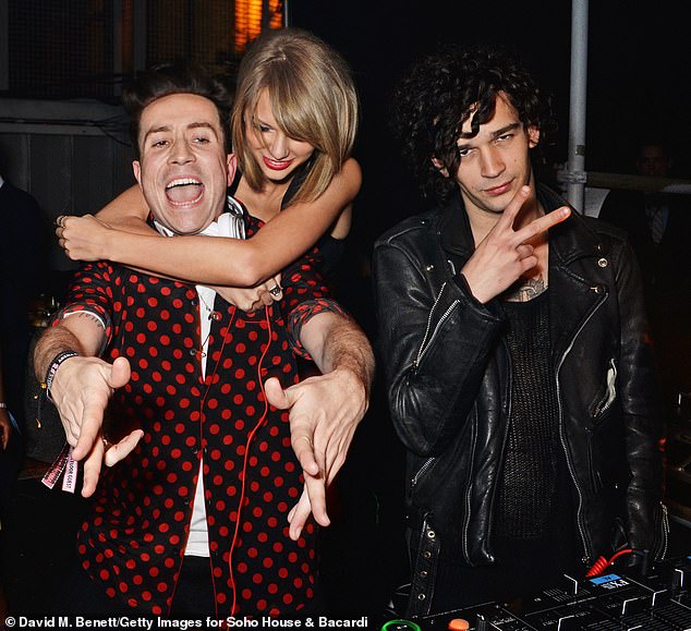 Taylor is pictured with Nick Grimshaw (left) and Matty (right) in 2015 in London. She reportedly met Matty when she attended a 1975 show in Los Angeles in November 2014