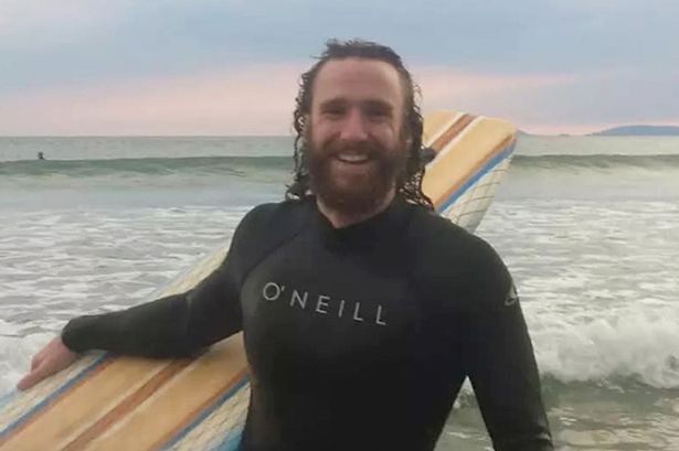 Alexander Barrett on a beach