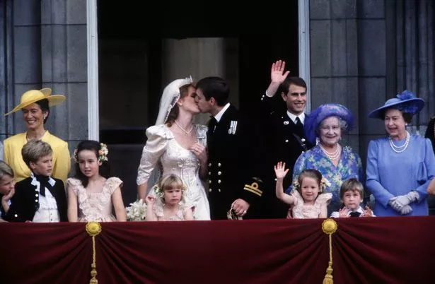 The Duke and Duchess of York kiss on the balcony of Buckingham Palace