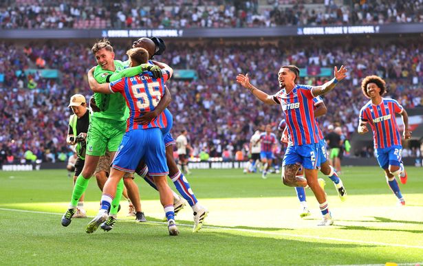 LONDON, ENGLAND - AUGUST 10: Justin Devenny of Crystal Palace celebrates with teammates after he scores the winning penalty during the penalty shootout during the 2025 FA Community Shield match between Crystal Palace and Liverpool at Wembley Stadium on August 10, 2025 in London, England. (Photo by Marc Atkins/Getty Images)