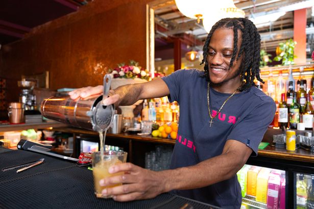 Image of bartender at Queen of the South pub