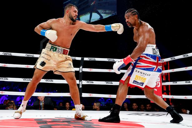 Joe Fournier throws a punch at David Haye 