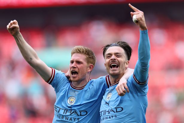 Kevin De Bruyne and Jack Grealish celebrate together