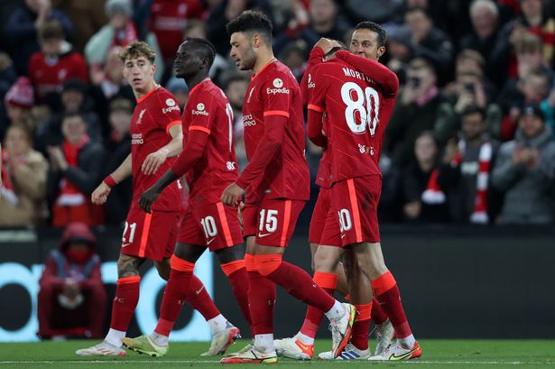 Thiago Alcantara of Liverpool celebrates after scoring their side's first goal with Tyler Morton during the UEFA Champions League group B match between Liverpool FC and FC Porto at Anfield on November 24, 2021 in Liverpool, England
