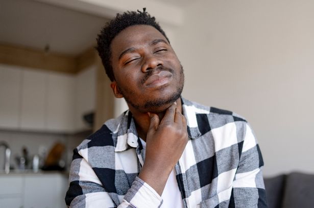 Man with sore throat