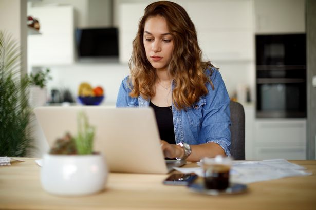 Woman paying her utility bills online