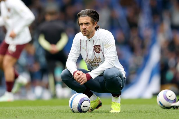 Jack Grealish looks on