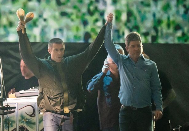 Liam Gallagher (L) and Noel Gallagher (R) of Oasis perform during the opening night of their Live 25' Tour at Principality Stadium on July 04, 2025 in Cardiff, Wales. (