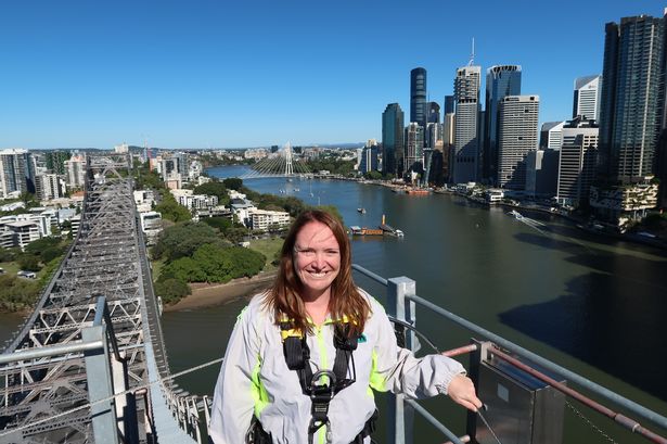 Clare on top of the bridge with views out across to Brisbane