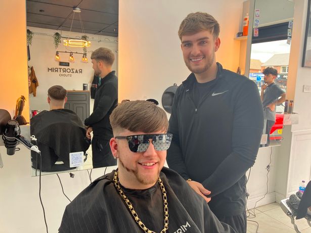Barber Ben McCabe giving Ollie Stokes, 17, the Ibiza Final Boss cut 
