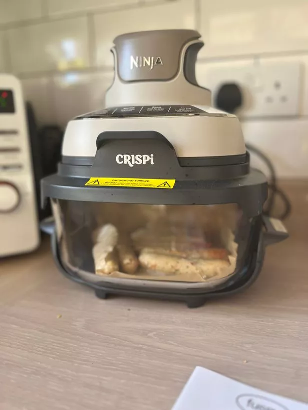 The Ninja Crispi is sleek, elegant and perfectly compact for my small kitchen. While the sausages pictured isn't the most exciting use for it, it certainly proved useful when I need meat cooked and don't want to turn the oven on.