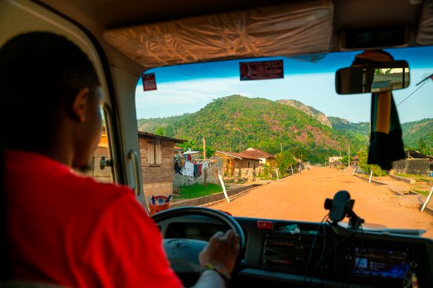 Intrepid driver Eric driving through the Volta village of Liati Wote