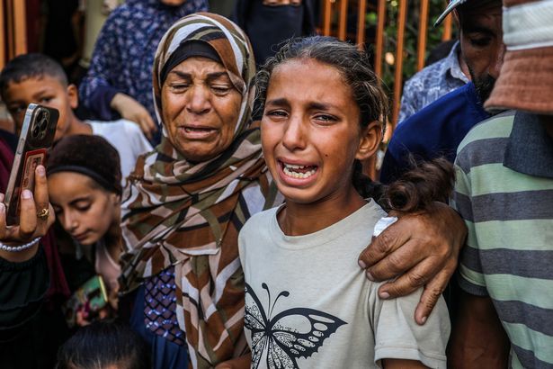 Relatives mourn the loss of children and other civilians in air strikes and shootings