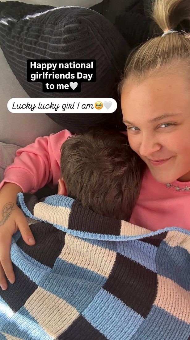 Chris Hughes and JoJo Siwa cuddled up together in a selfie.