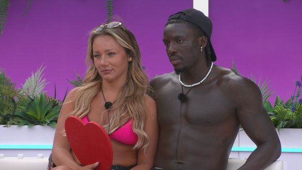 Meg Moore and Dejon Noel-Williams sat in the Love Island villa.