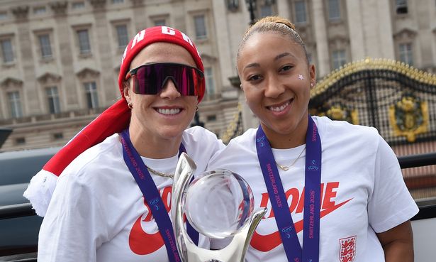 Lucy Bronze and Lauren James pose with winning trophy at Euros celebrations