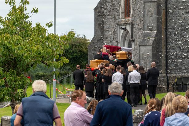 Three coffins were carried into the Church of the Immaculate Conception